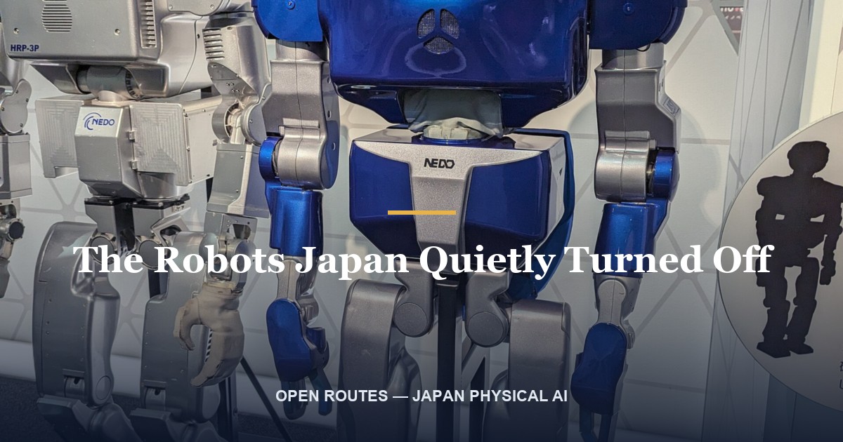 A humanoid service robot standing idle in an empty lobby